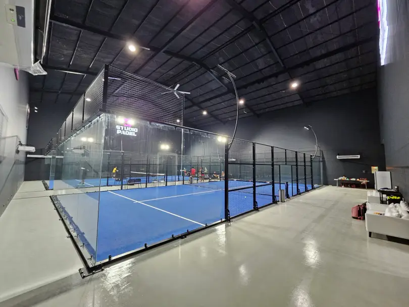 A court seen past the glass wall
