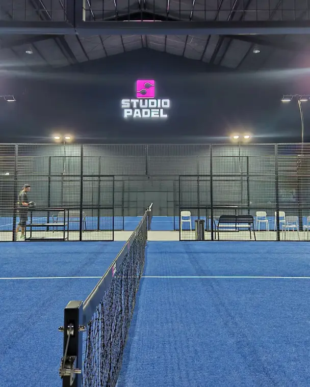 At the net on blue turf