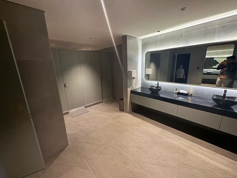 Washroom with backlit mirror